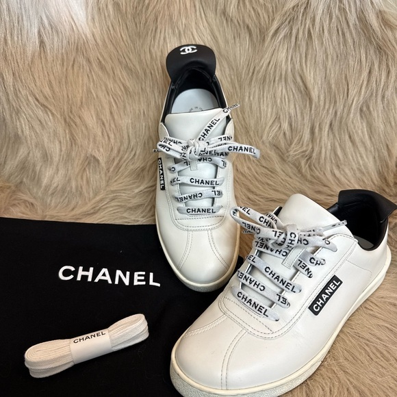 CHANEL Shoes - CHANEL Black and White Sneakers with Logo Detail
